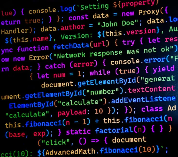 Close-up of colorful JavaScript code displayed on a computer monitor, ideal for tech-themed projects. - iptv code 12 months
