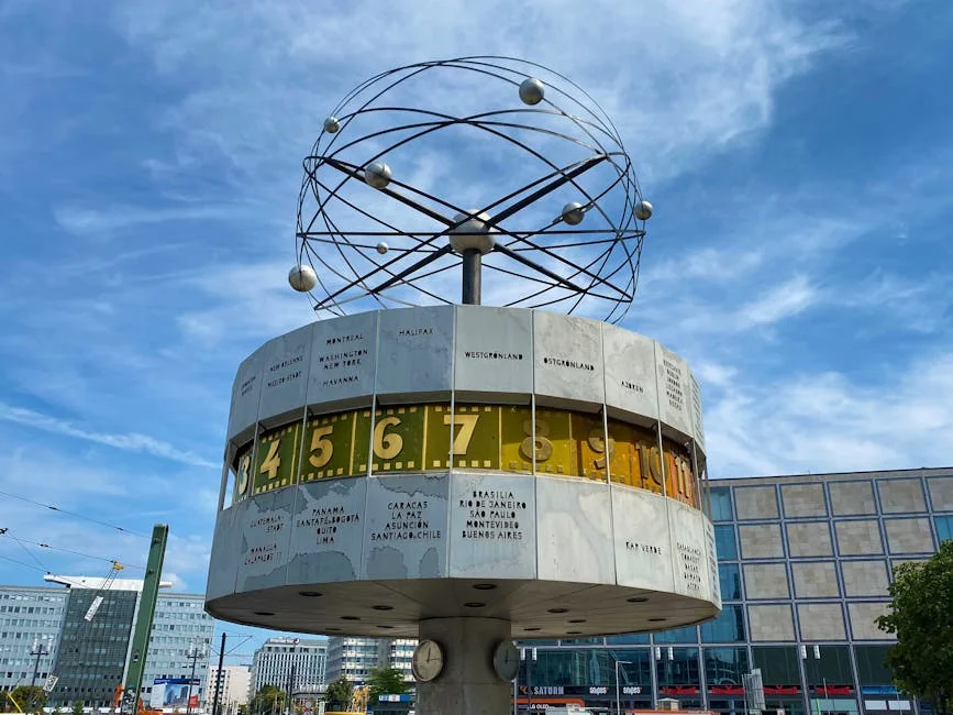 Iconic image of Berlin's World Clock at Alexanderplatz under a vibrant blue sky. - iptv deutschland