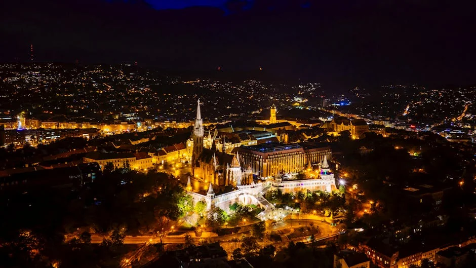 Captivating aerial view of Budapest at night featuring Matthias Church and the Fisherman's Bastion. - iptv europe