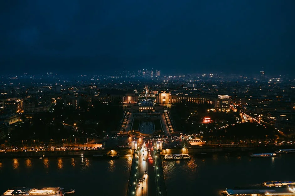 Stunning nighttime aerial cityscape of Paris highlighting iconic landmarks. - iptv france