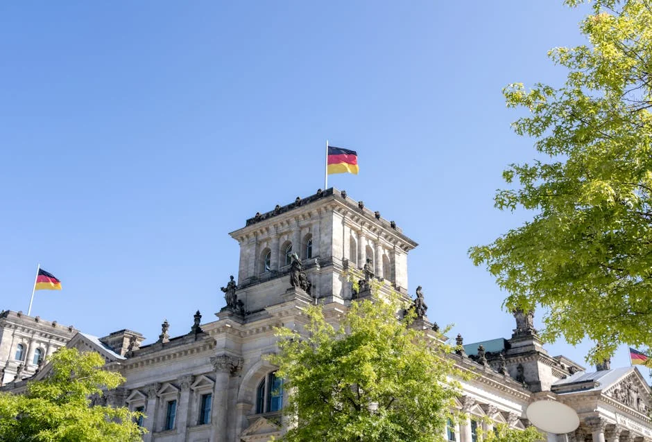 Reichstag Building in Berlin showcasing German flags on a sunny day. - iptv m3u germany 4k