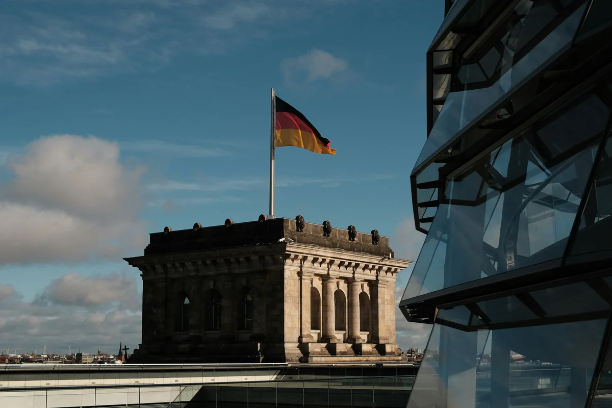 a building with a flag on top of it - iptv germany