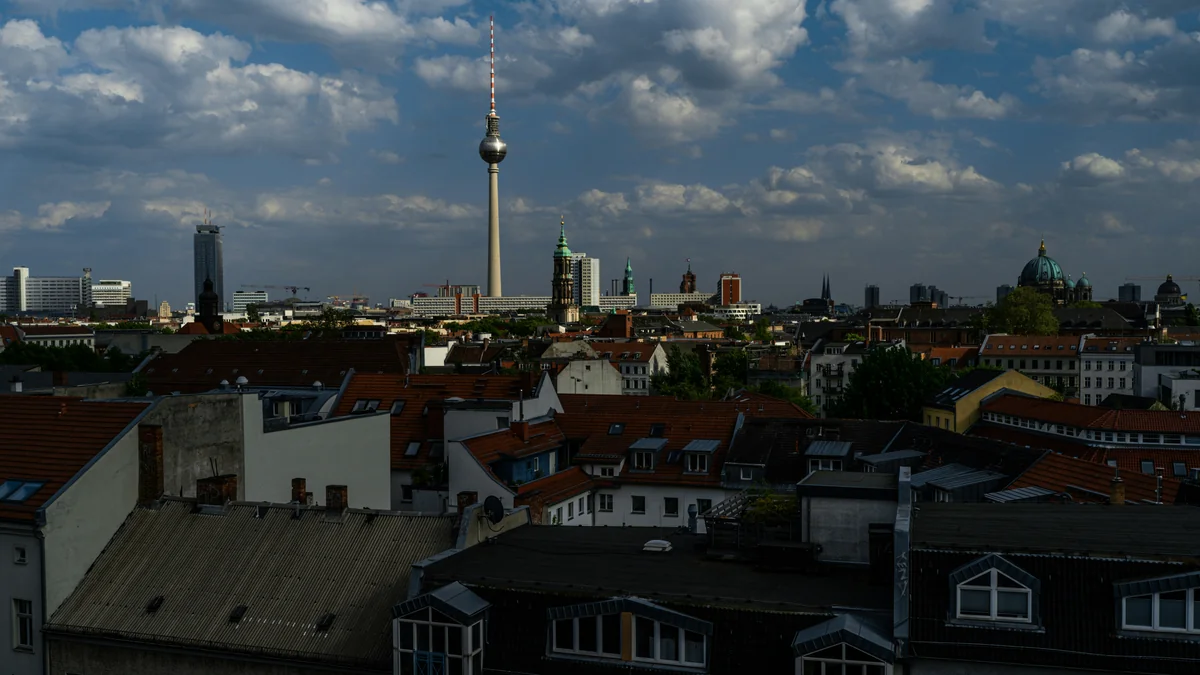 a view of a city skyline with a tower in the distance - iptv germany