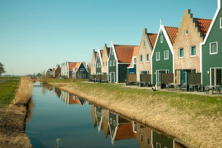 Traditional Dutch houses reflecting in a canal in Volendam, North Holland, Netherlands. - iptv netherlands