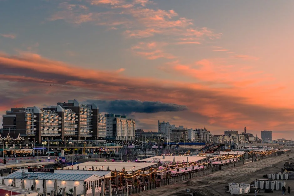 A breathtaking sunset view over Scheveningen Beach in The Hague, Netherlands, showcasing vibrant skies and lively promenade. - iptv netherlands
